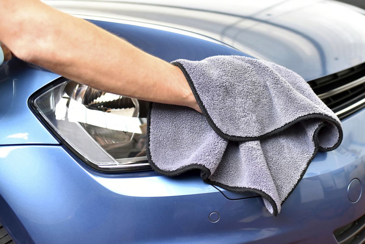 man-polishing-car-royalty-free-image-1623497498